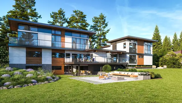 Modern two-story home with wood and white panel siding, glass railings and a stone patio on a wide lawn